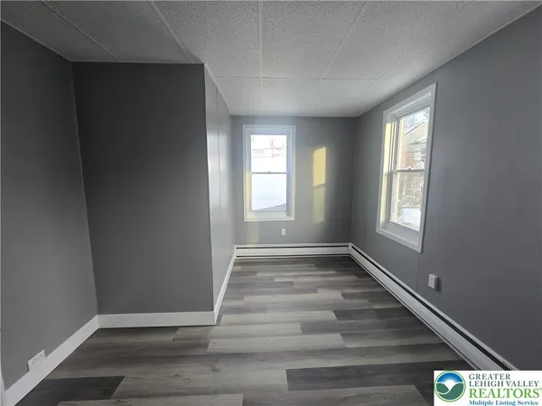 a view of an empty room and window