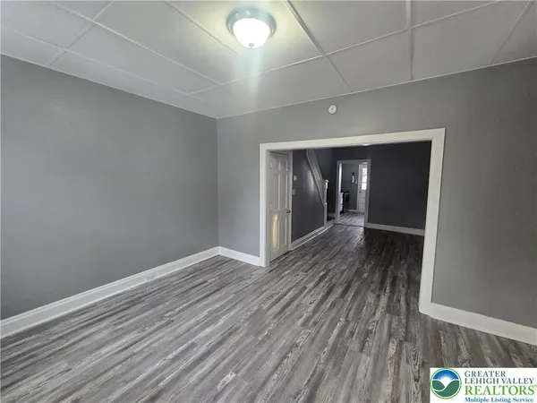 a view of hallway with wooden floor