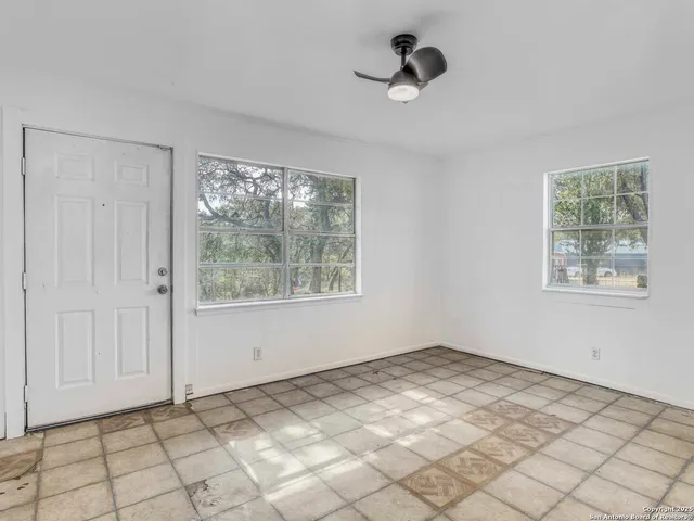 a view of an empty room and window