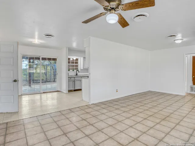 a view of an empty room and window