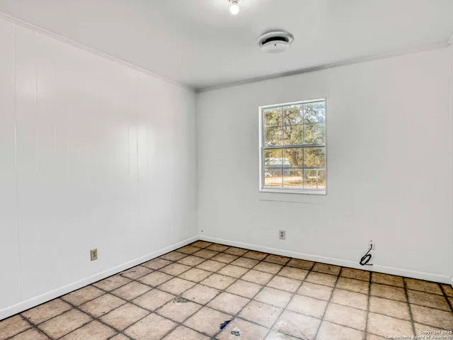 a view of an empty room and window