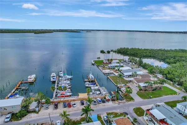 an aerial view of a houses with a lake view