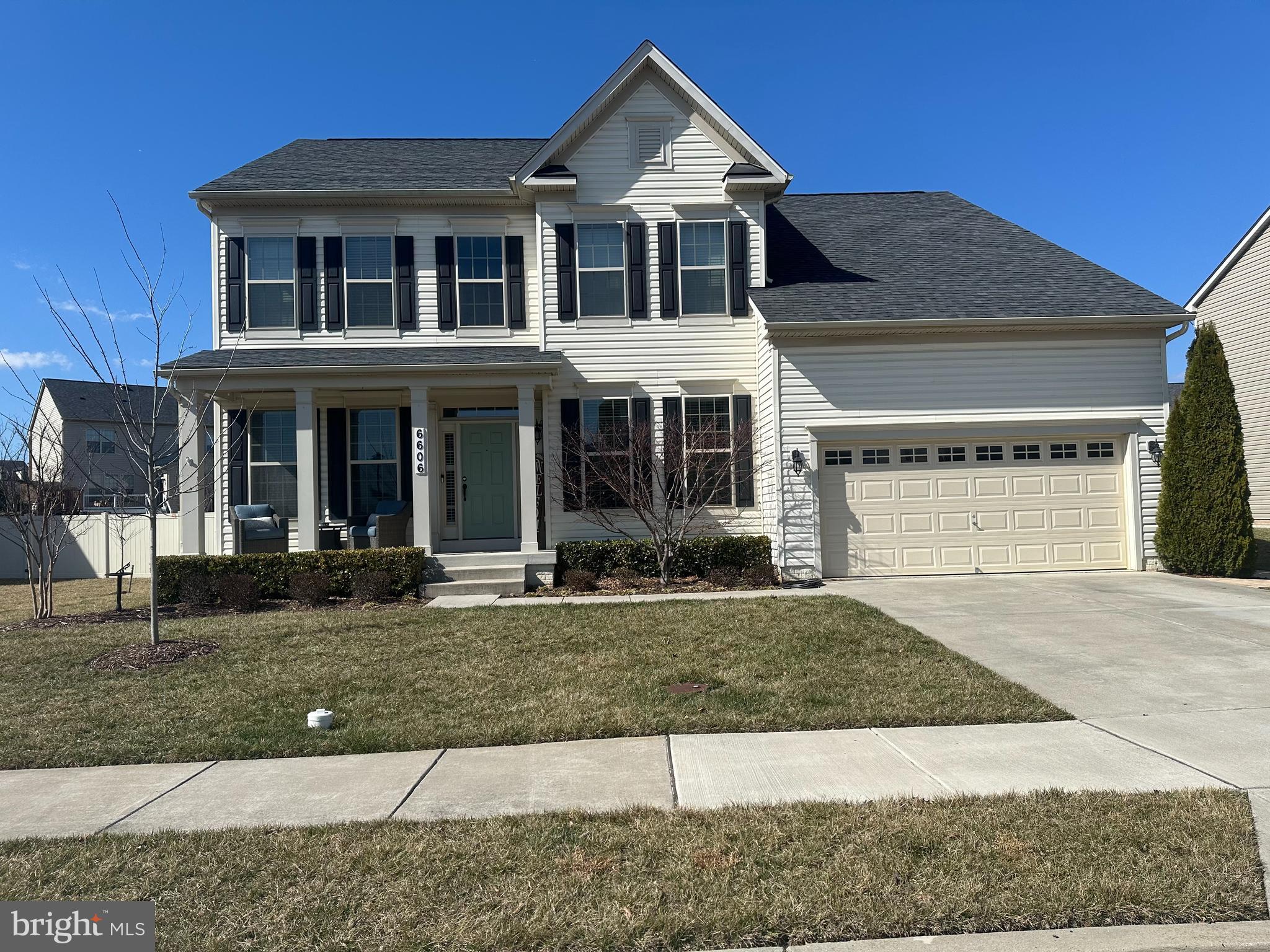 a front view of a house with garage