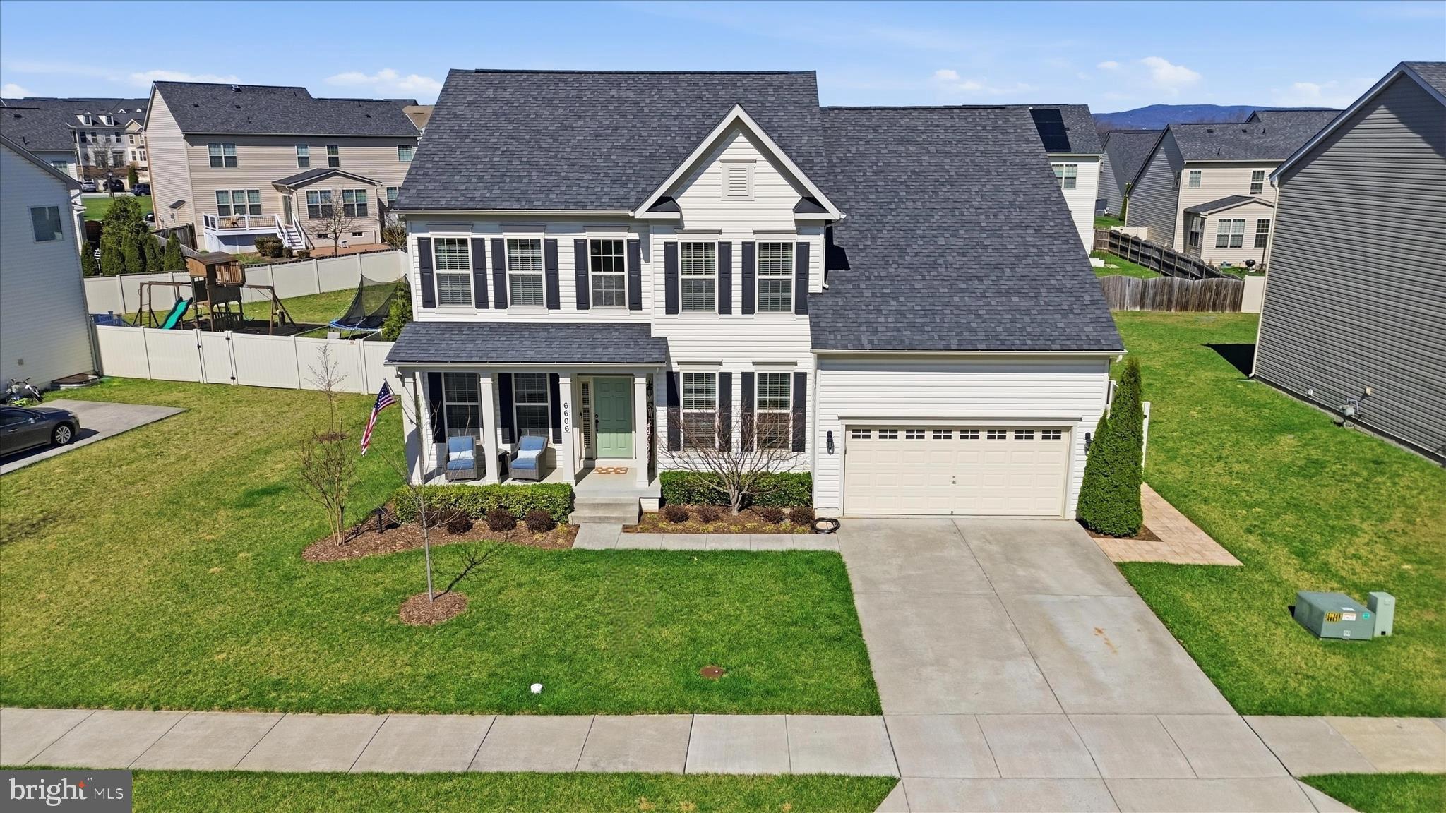 6606 Corbel Way Frederick, MD 21703 - Photo 1 of 60 a front view of a house with a yard