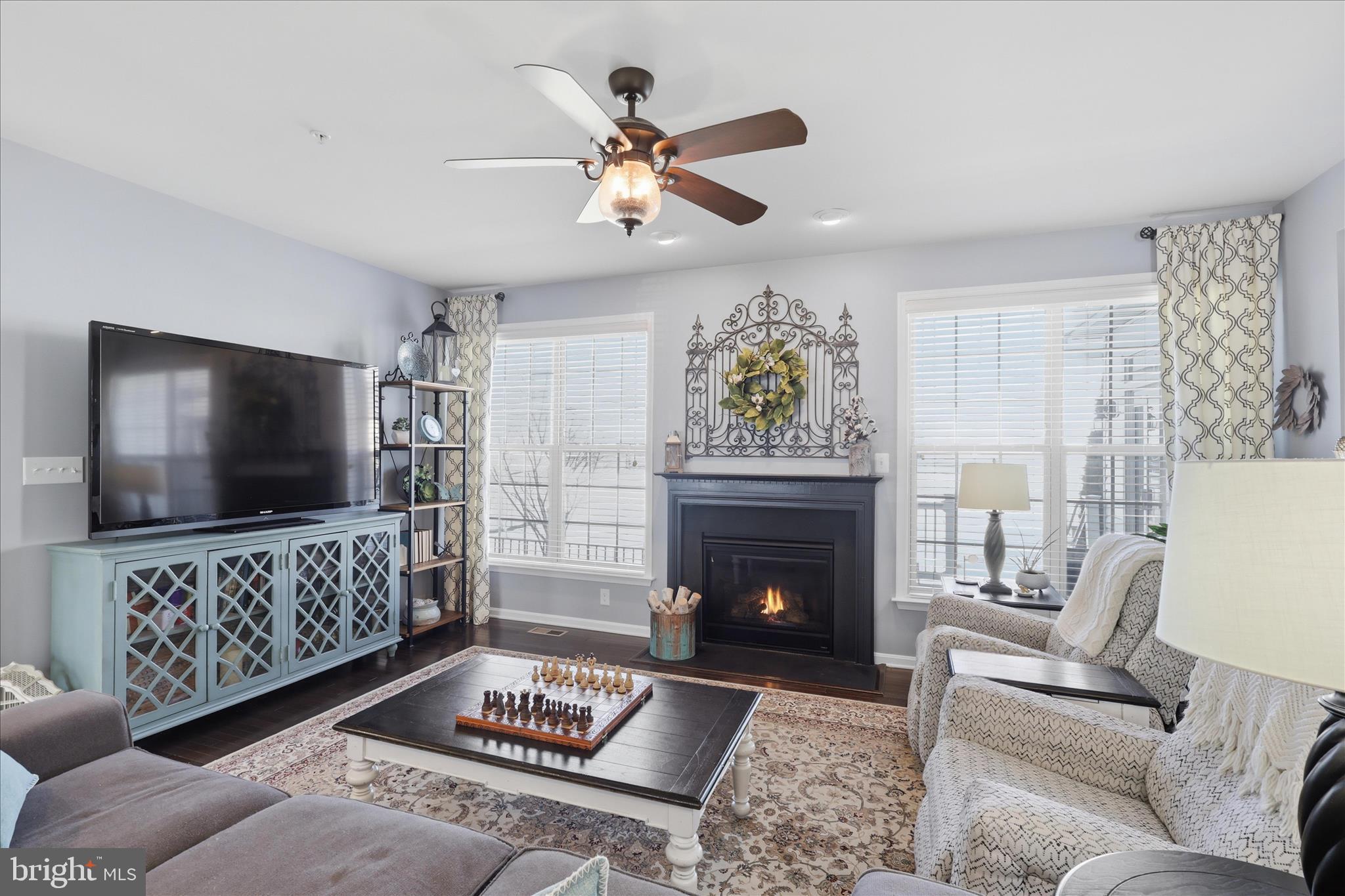 6606 Corbel Way Frederick, MD 21703 - Photo 15 of 60 a living room with furniture and a flat screen tv