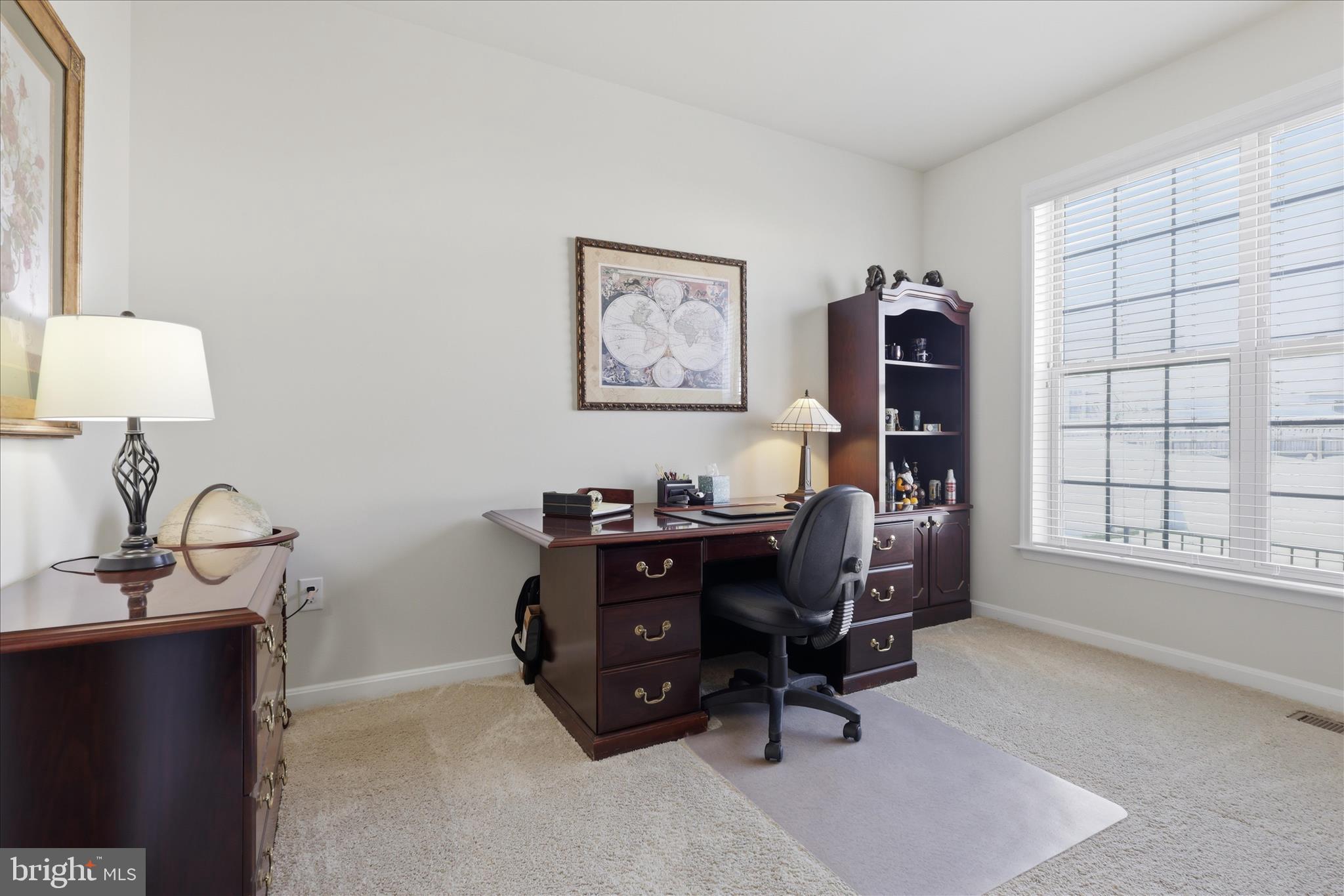 6606 Corbel Way Frederick, MD 21703 - Photo 17 of 60 a view of a workspace with furniture and a window