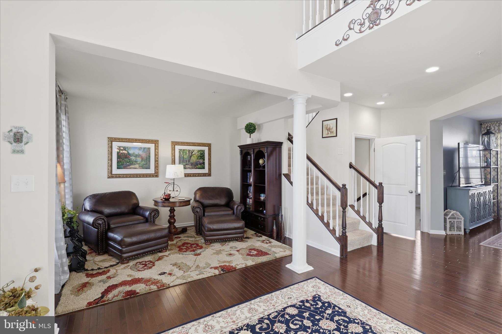 6606 Corbel Way Frederick, MD 21703 - Photo 19 of 60 a living room with furniture and wooden floor