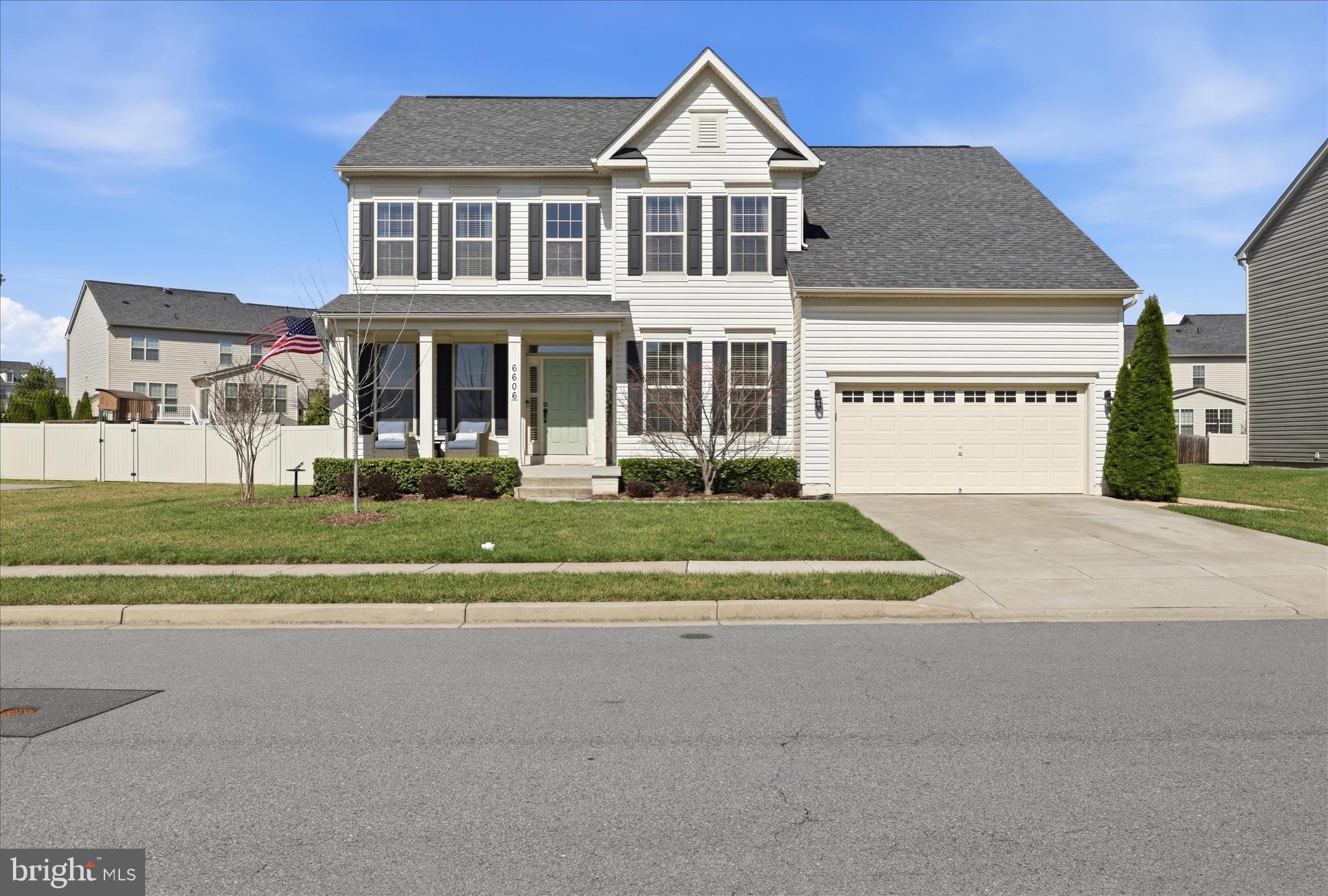 6606 Corbel Way Frederick, MD 21703 - Photo 2 of 60 a front view of a house with a yard