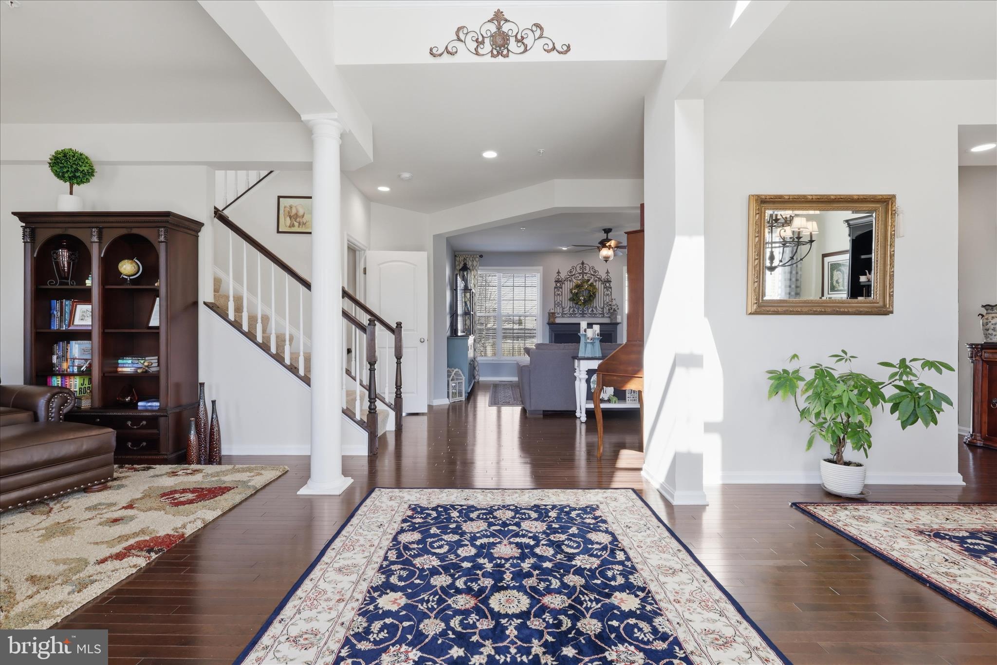 6606 Corbel Way Frederick, MD 21703 - Photo 21 of 60 a view of a hallway view with wooden floor and a rug