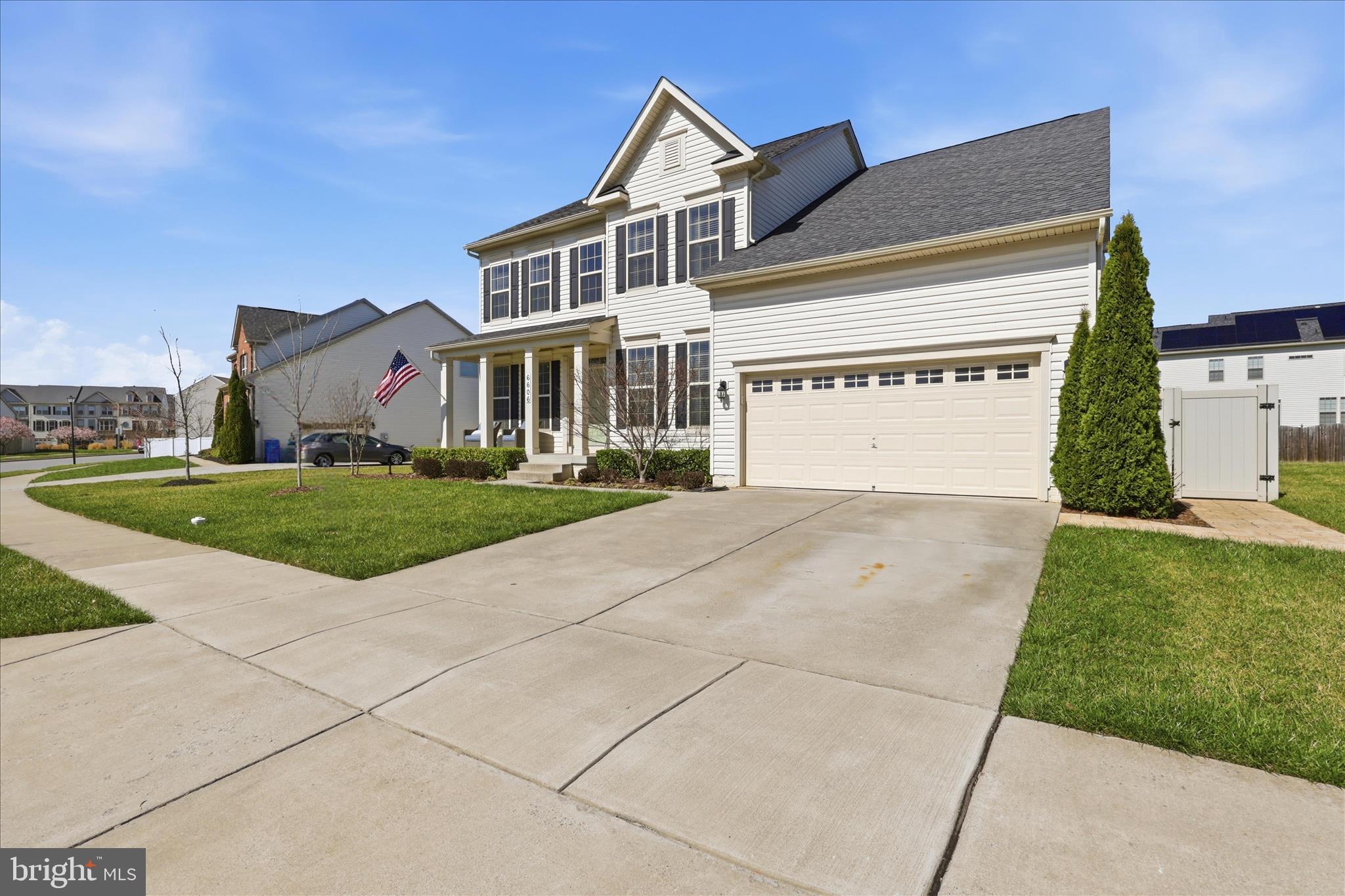 6606 Corbel Way Frederick, MD 21703 - Photo 3 of 60 a view of a white house with a yard