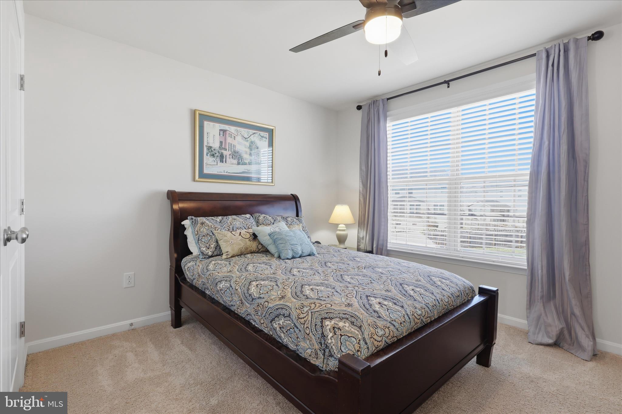 6606 Corbel Way Frederick, MD 21703 - Photo 33 of 60 a bedroom with a bed and window