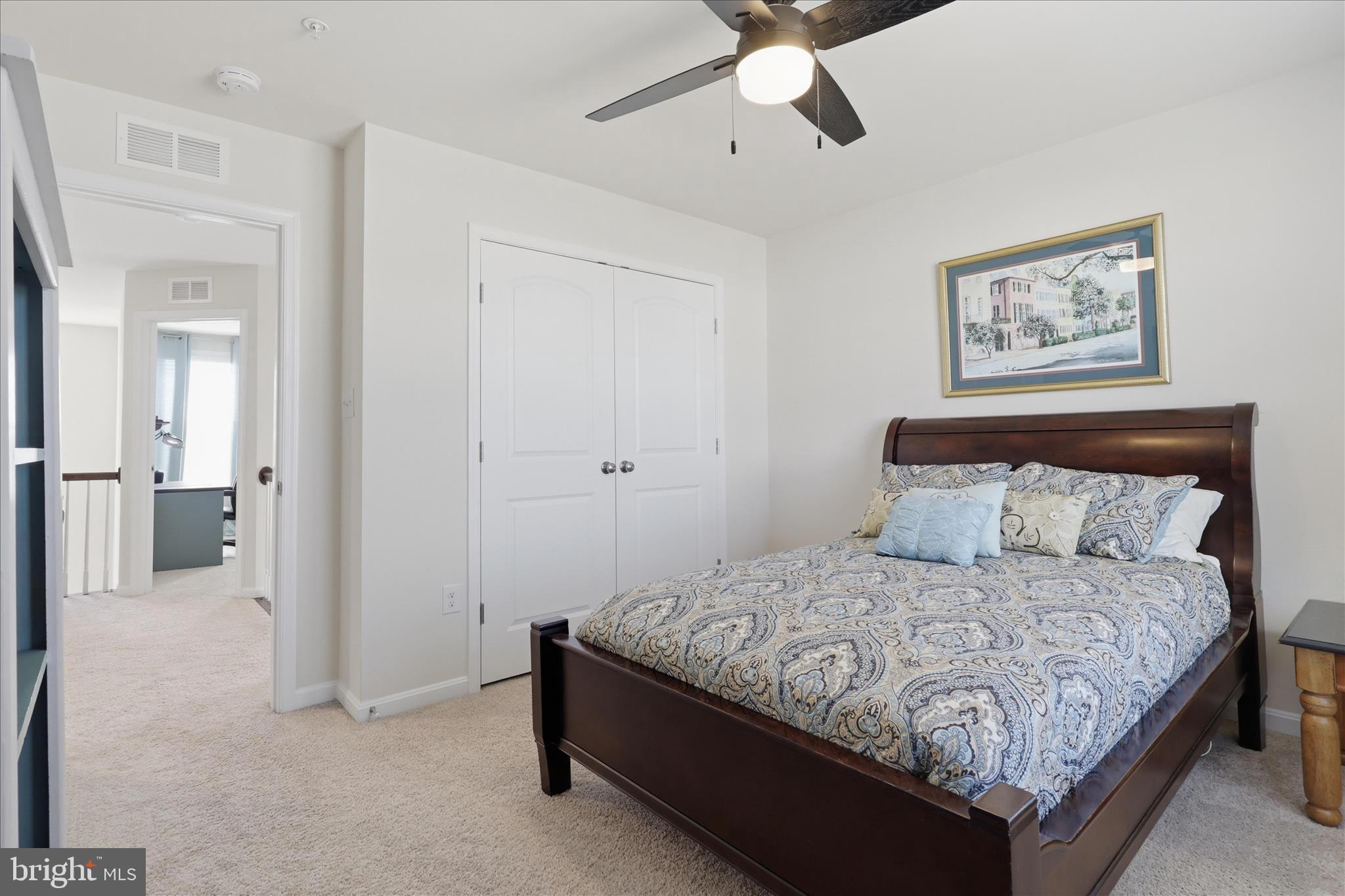 6606 Corbel Way Frederick, MD 21703 - Photo 34 of 60 a bedroom with a bed and wall painting