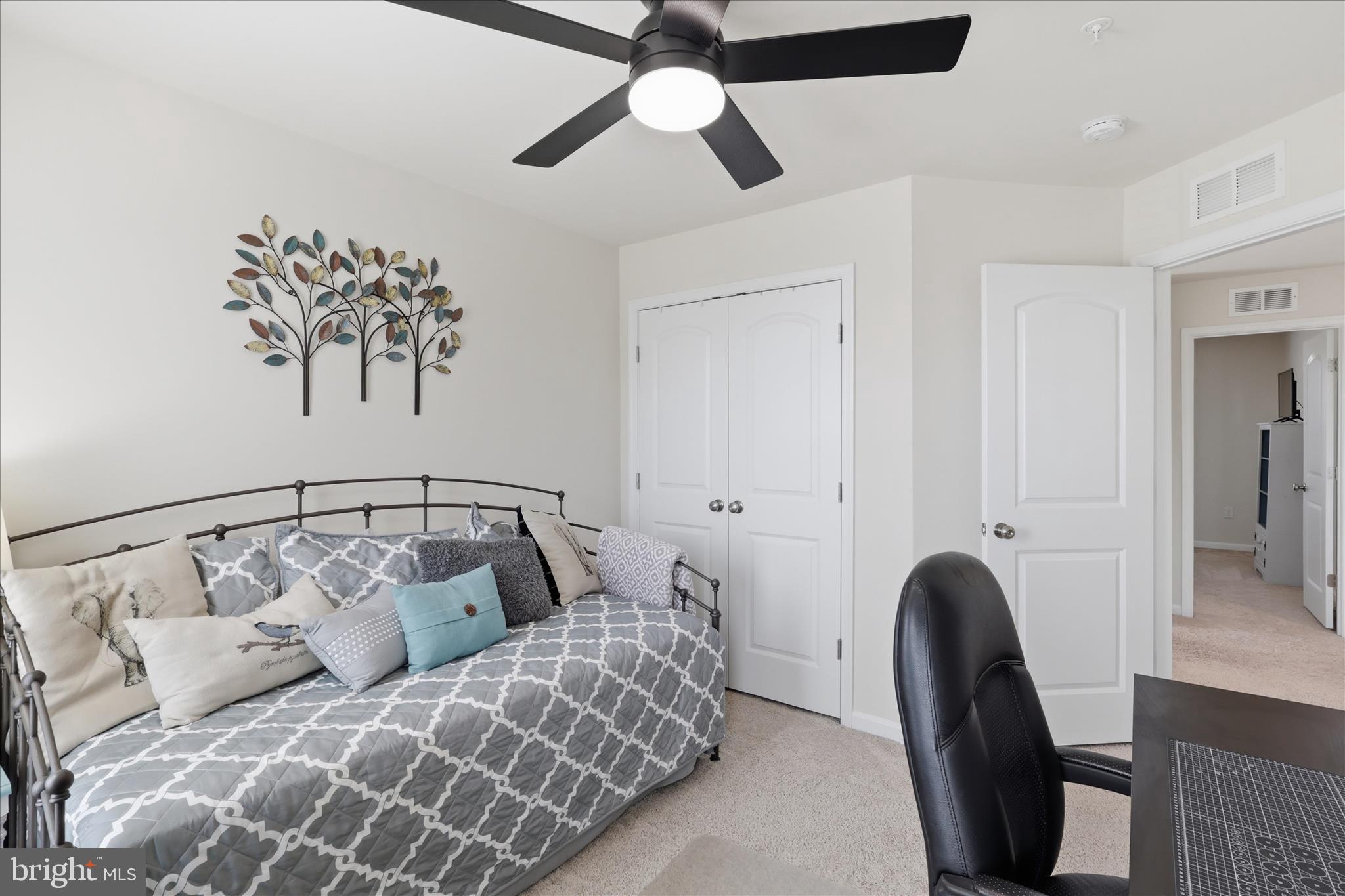 6606 Corbel Way Frederick, MD 21703 - Photo 37 of 60 a bedroom with a bed and a chandelier