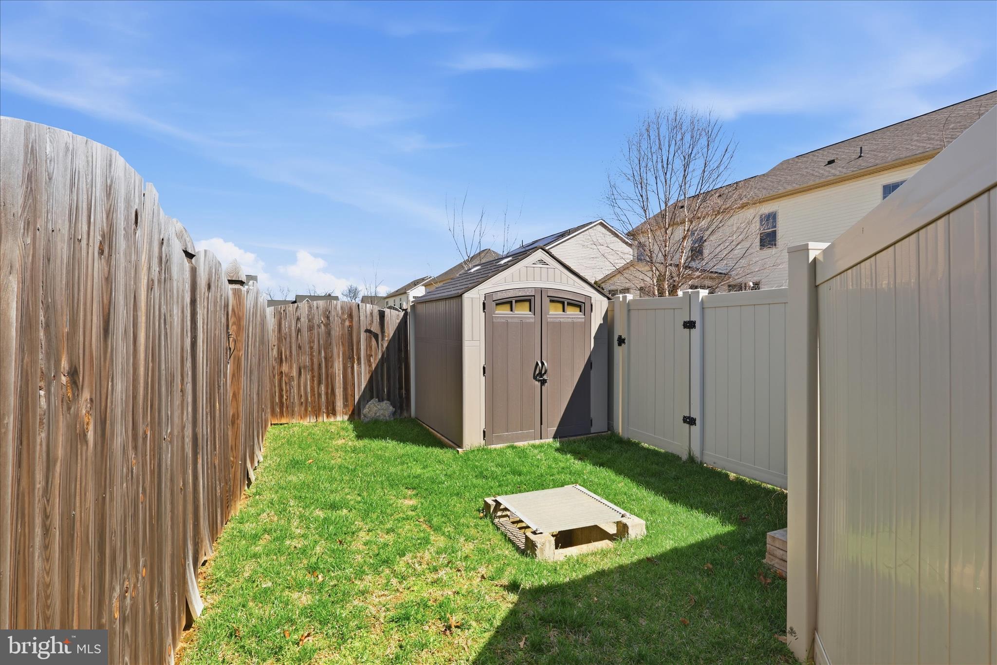 6606 Corbel Way Frederick, MD 21703 - Photo 52 of 60 a backyard of a house with table and chairs