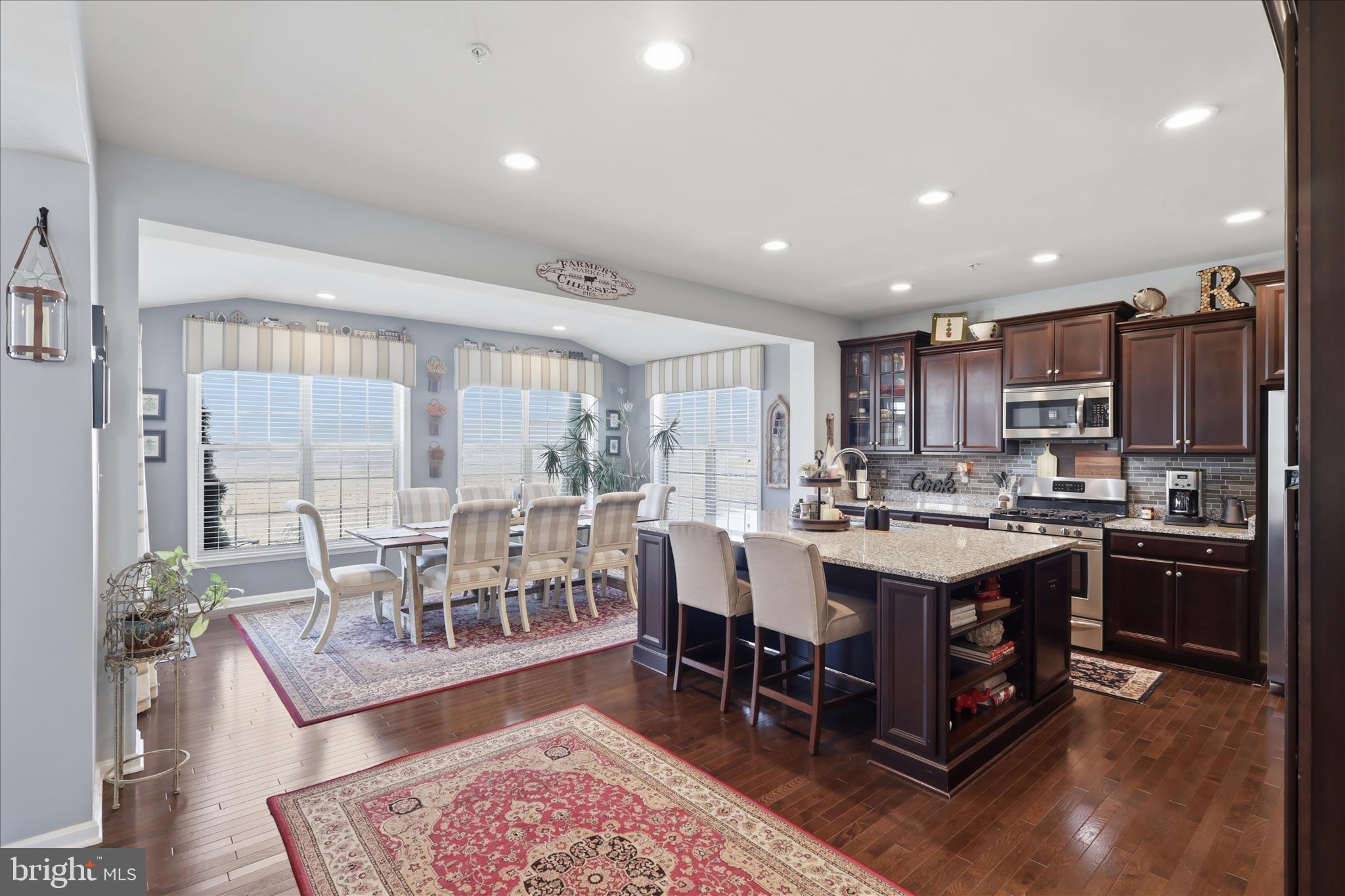 6606 Corbel Way Frederick, MD 21703 - Photo 7 of 60 a large kitchen with a table and chairs