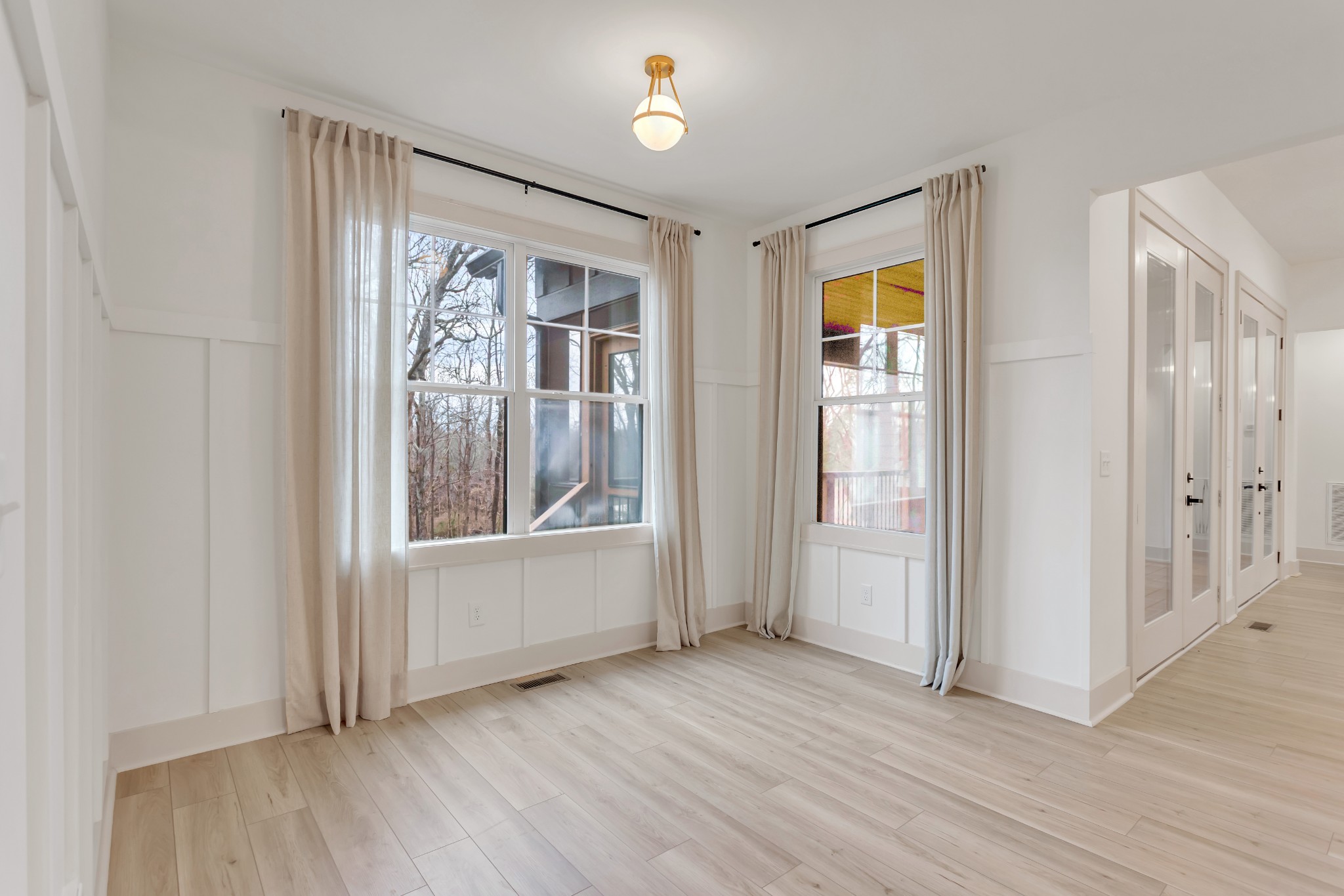 2140 Abiff Road Burns, TN 37029 - Photo 13 of 40 an empty room with wooden floor and windows
