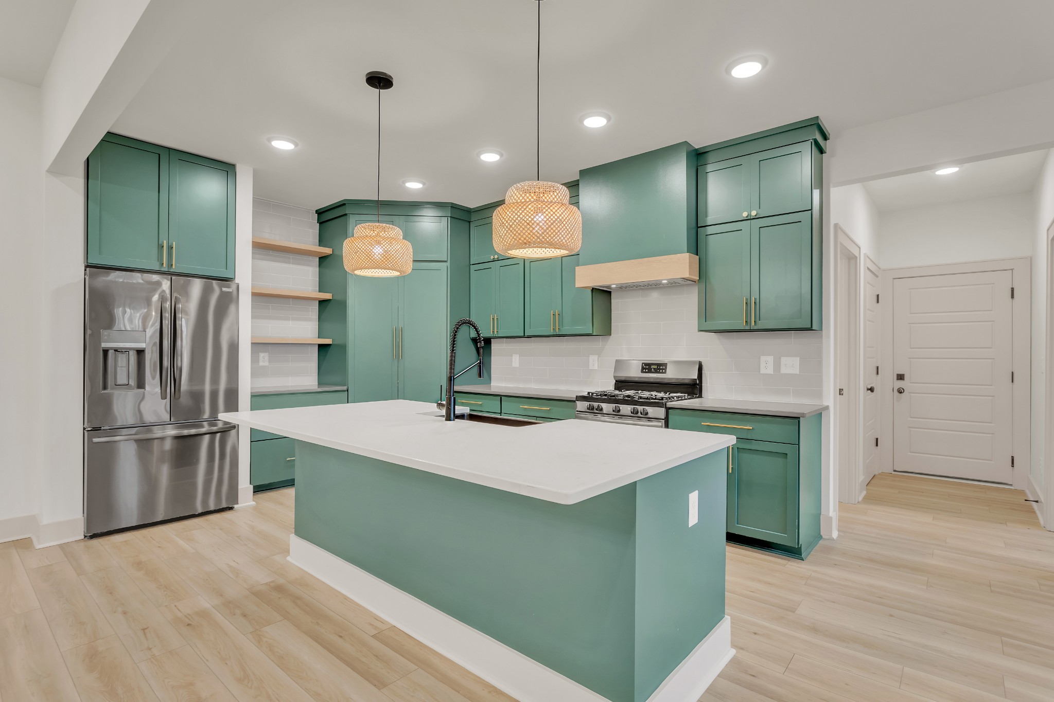 2140 Abiff Road Burns, TN 37029 - Photo 8 of 40 a kitchen with kitchen island a stove and a refrigerator