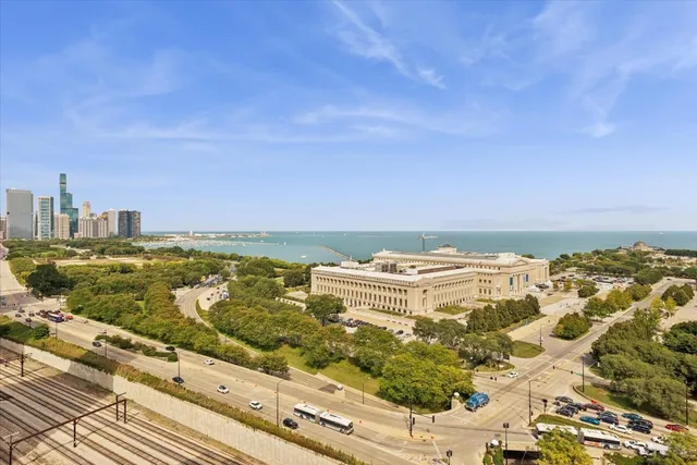 a view of city with ocean