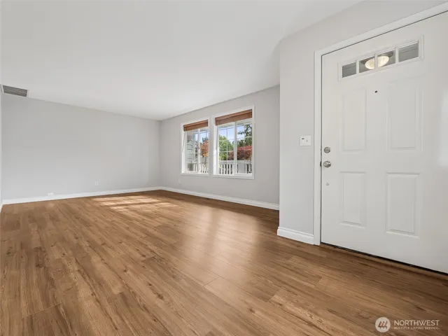 a view of kitchen with wooden floor and window
