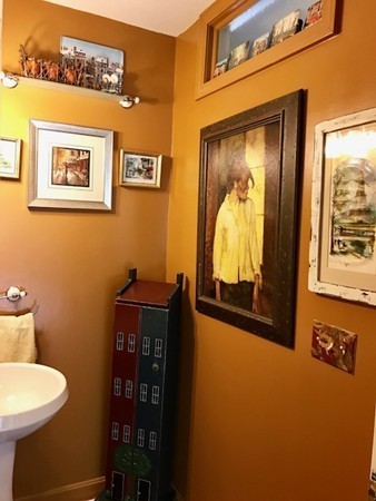 211 Westhampton Road Northampton, MA 01062 - Photo 13 of 21 a view of a hallway with paintings on the wall