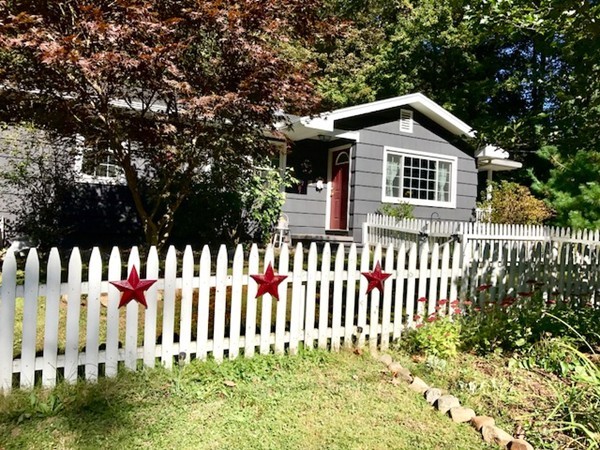 211 Westhampton Road Northampton, MA 01062 - Photo 2 of 21 a front view of a house with a small yard