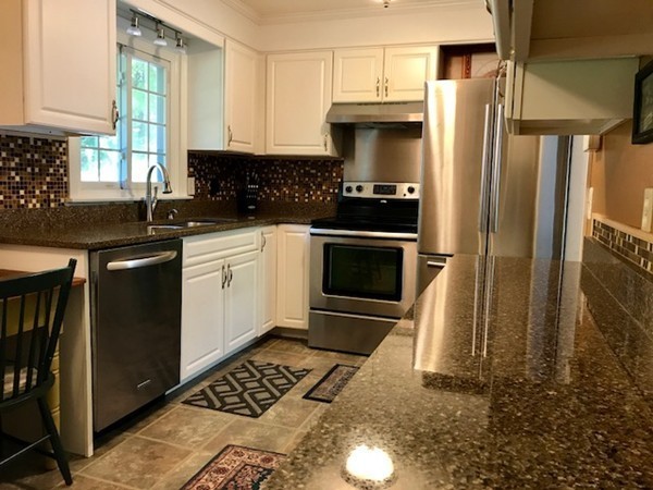 211 Westhampton Road Northampton, MA 01062 - Photo 4 of 21 a kitchen with stainless steel appliances granite countertop a stove a sink and a refrigerator