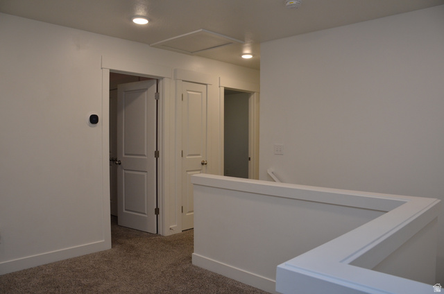 1842 South 1280th Street West Logan, UT 84321 - Photo 10 of 21 Upper-level landing featuring plush gray carpeting, white painted walls, recessed lighting, and white trimmed doorways