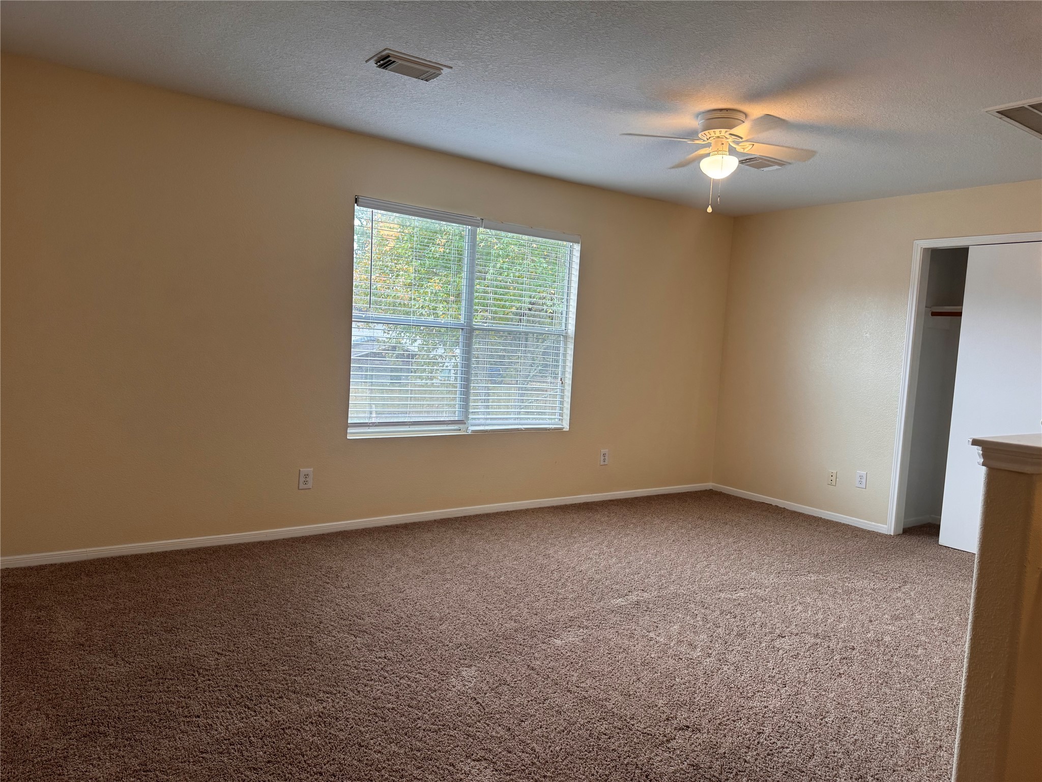 12206 Beacon Tree Court Humble, TX 77346 - Photo 17 of 25 a view of an empty room with a window