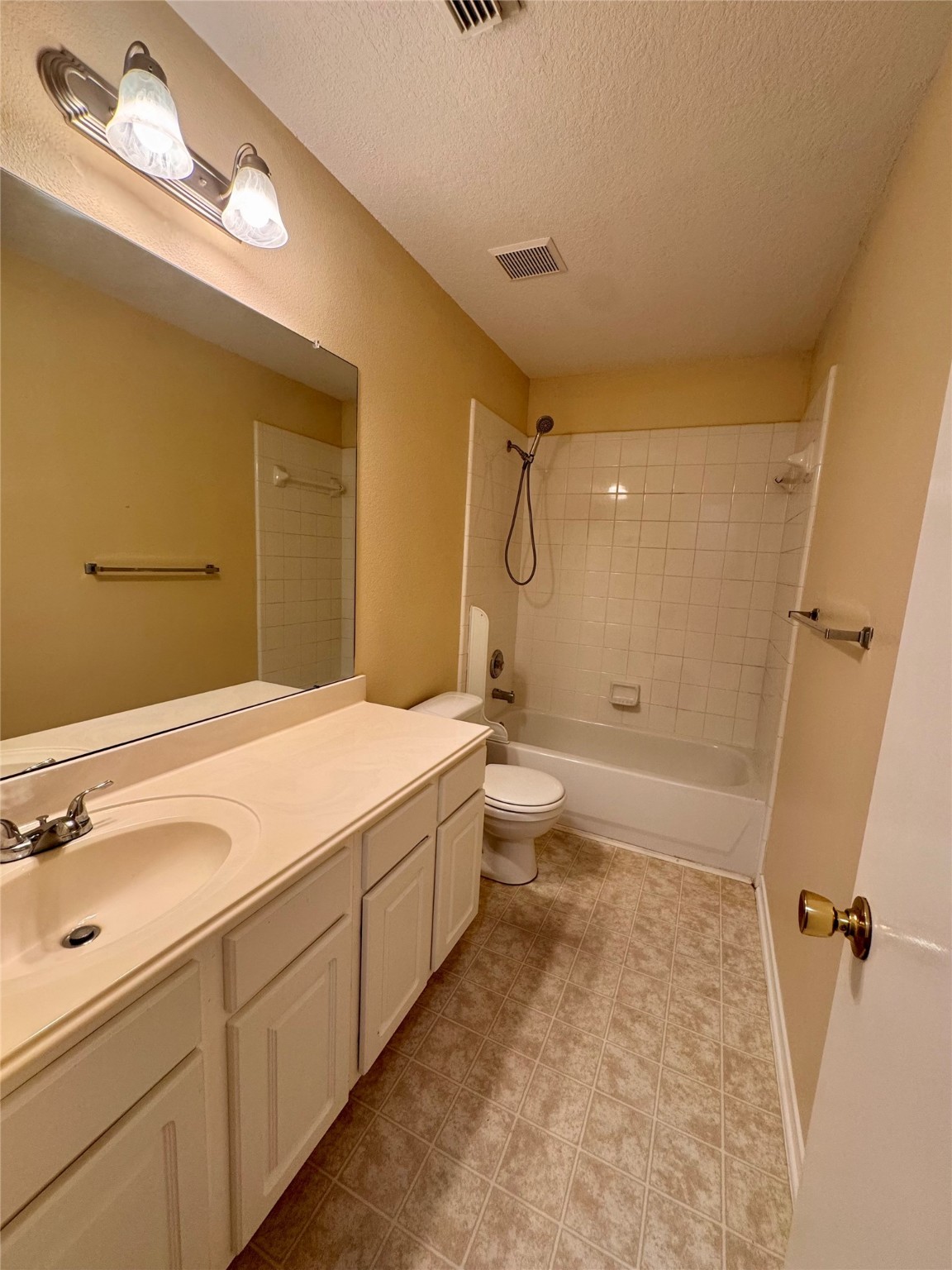 12206 Beacon Tree Court Humble, TX 77346 - Photo 20 of 25 a spacious bathroom with a double vanity sink toilet mirror and shower