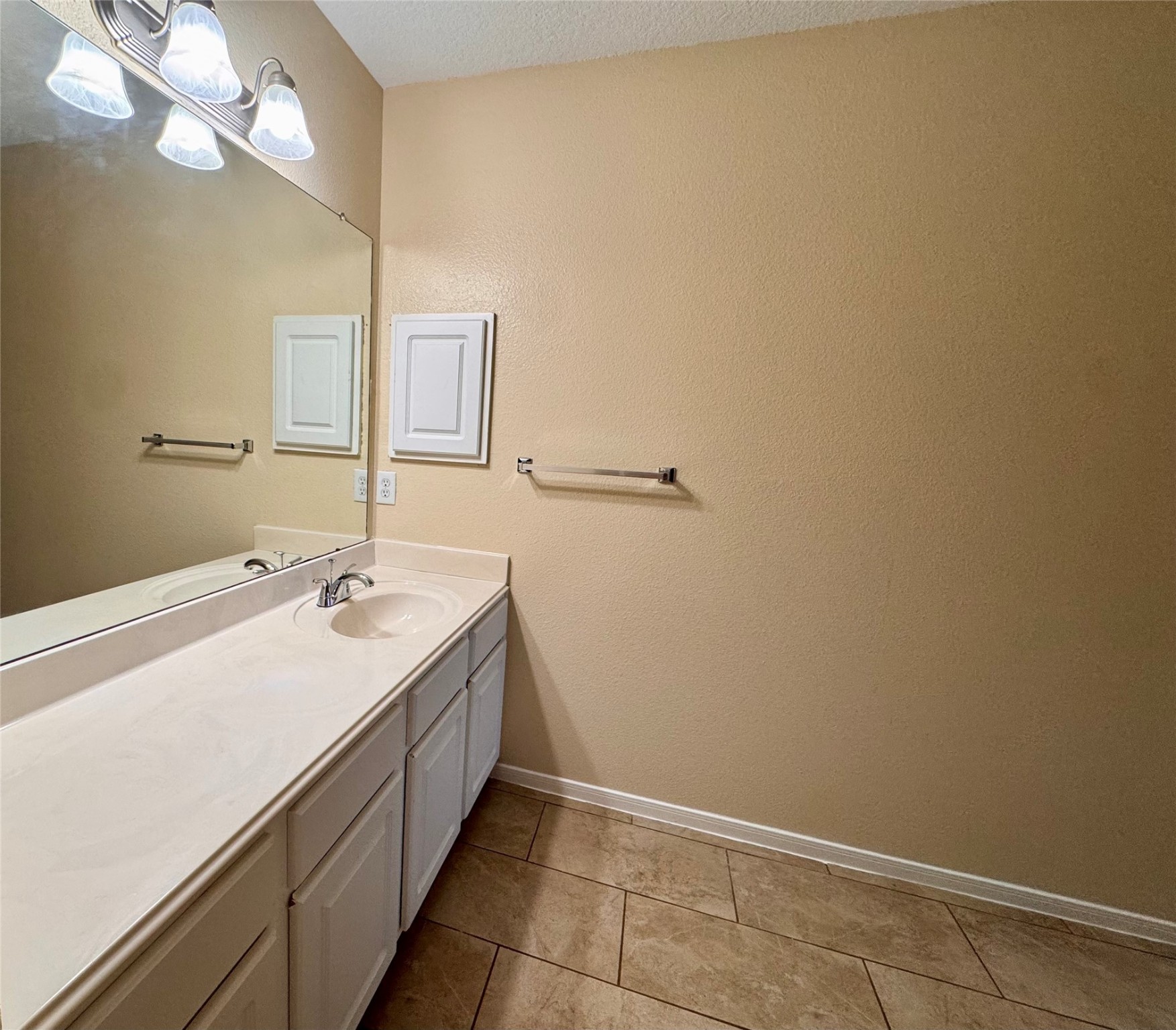 12206 Beacon Tree Court Humble, TX 77346 - Photo 24 of 25 a bathroom with a sink and a mirror