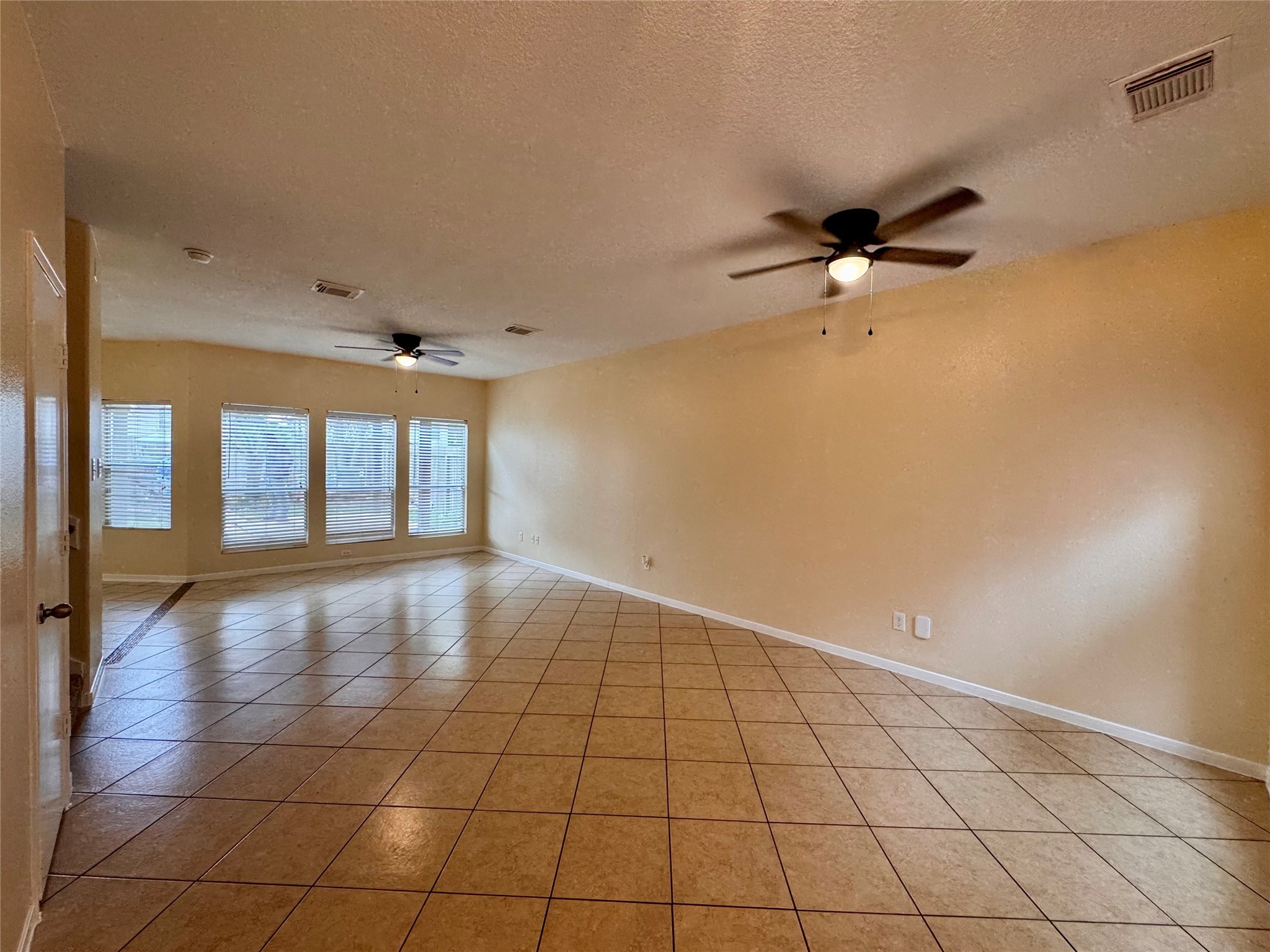 12206 Beacon Tree Court Humble, TX 77346 - Photo 3 of 25 a view of an empty room and a window