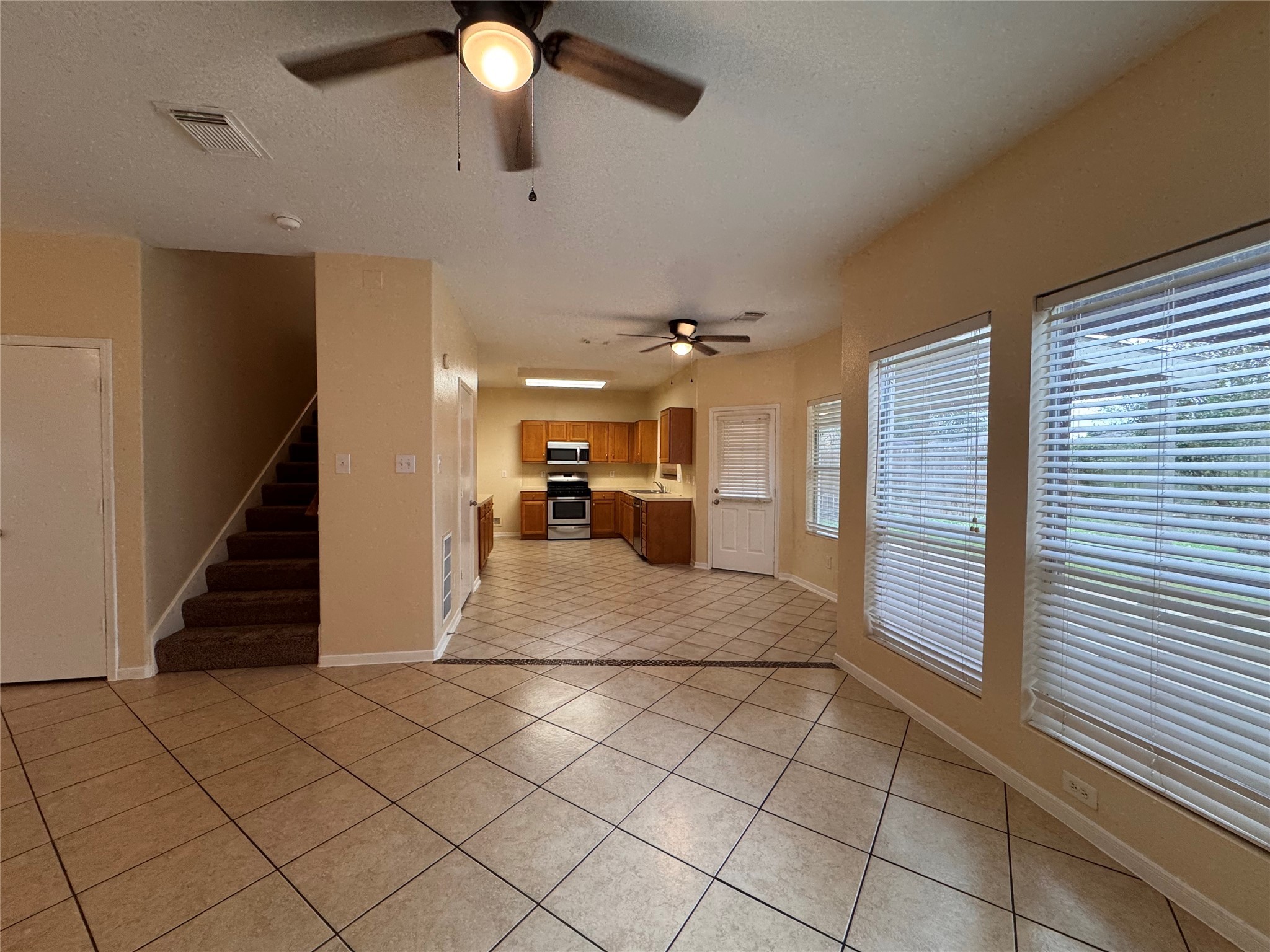 12206 Beacon Tree Court Humble, TX 77346 - Photo 7 of 25 a view of kitchen with furniture and a window