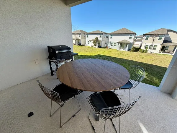 a view of a patio in backyard