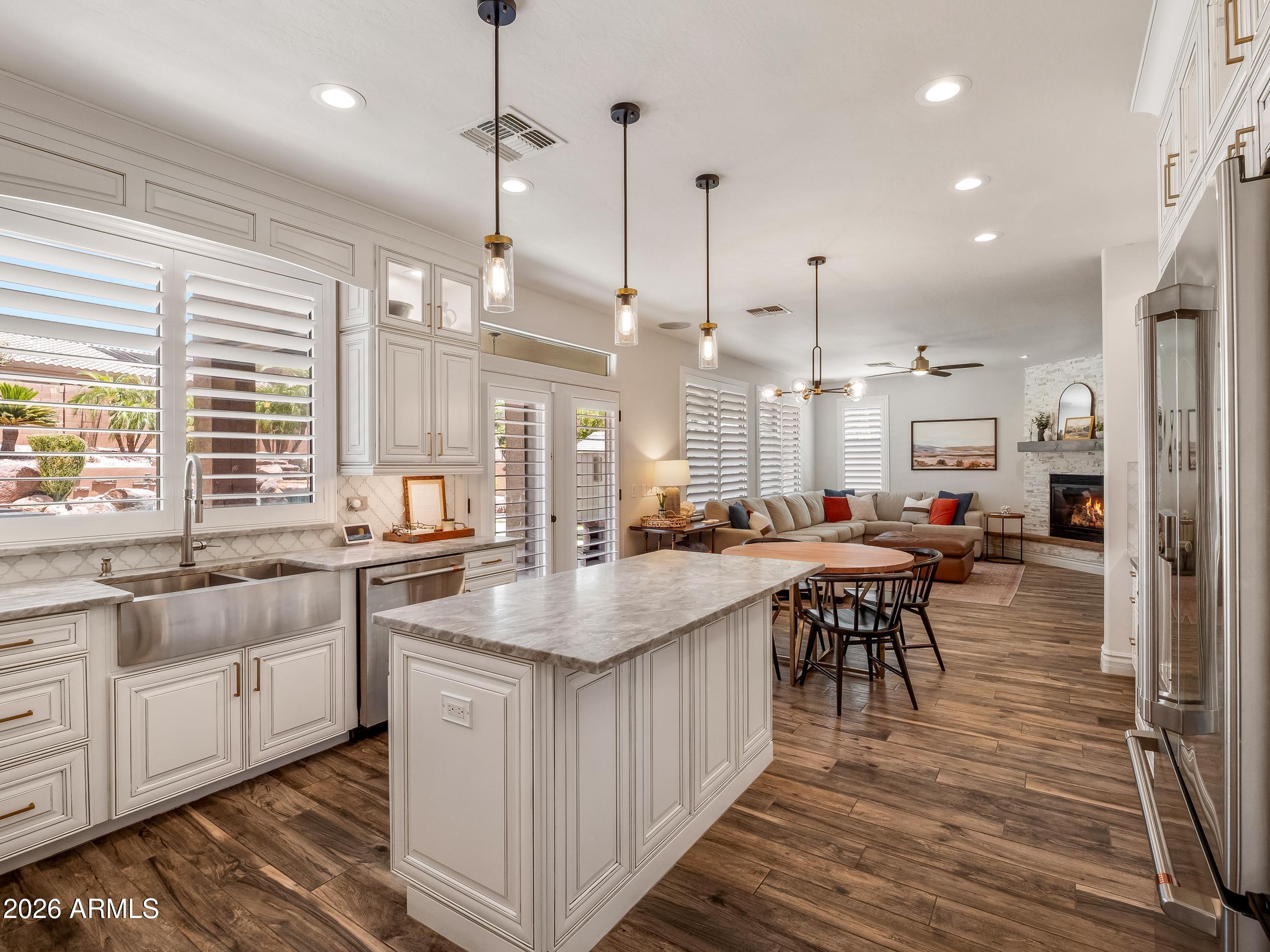 3416 West Montello Road Phoenix, AZ 85086 - Photo 21 of 68 Kitchen island with pendant lights