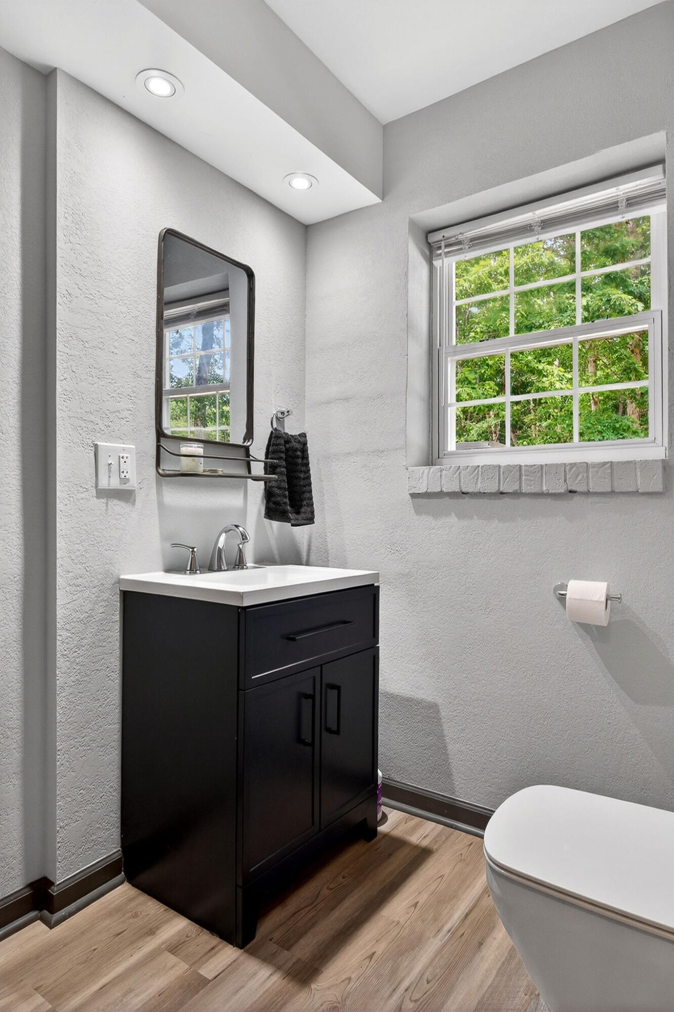 9388 Harrison Ferry Road McMinnville, TN 37110 - Photo 27 of 41 a bathroom with a sink toilet and window