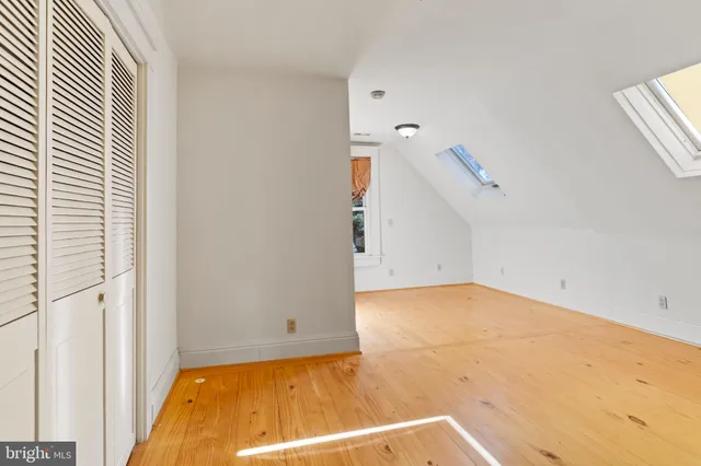 a view of a room with white walls