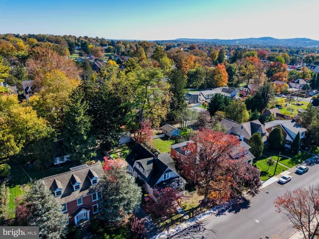 an aerial view of a house with a lake view