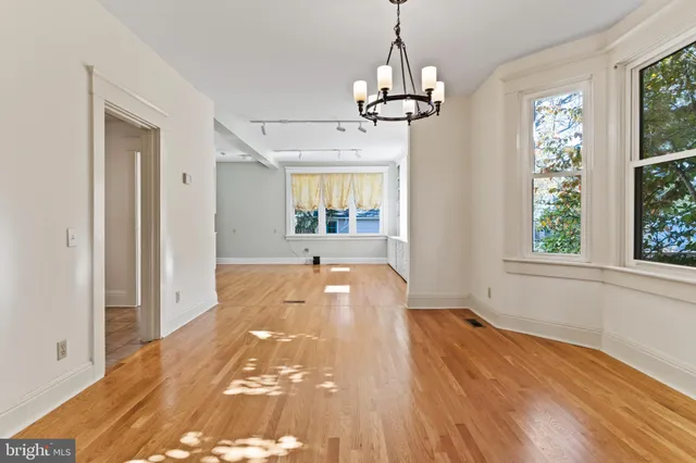 a view of livingroom with chandelier and window