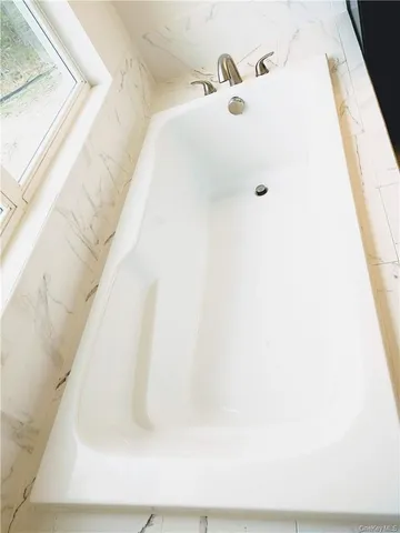 a bathroom with a bathtub