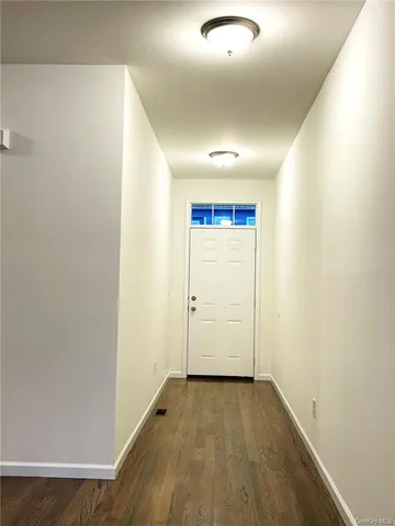 an empty room with wooden floor