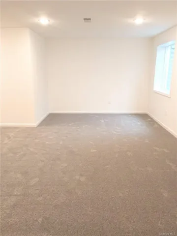 a white toilet sitting next to a shower