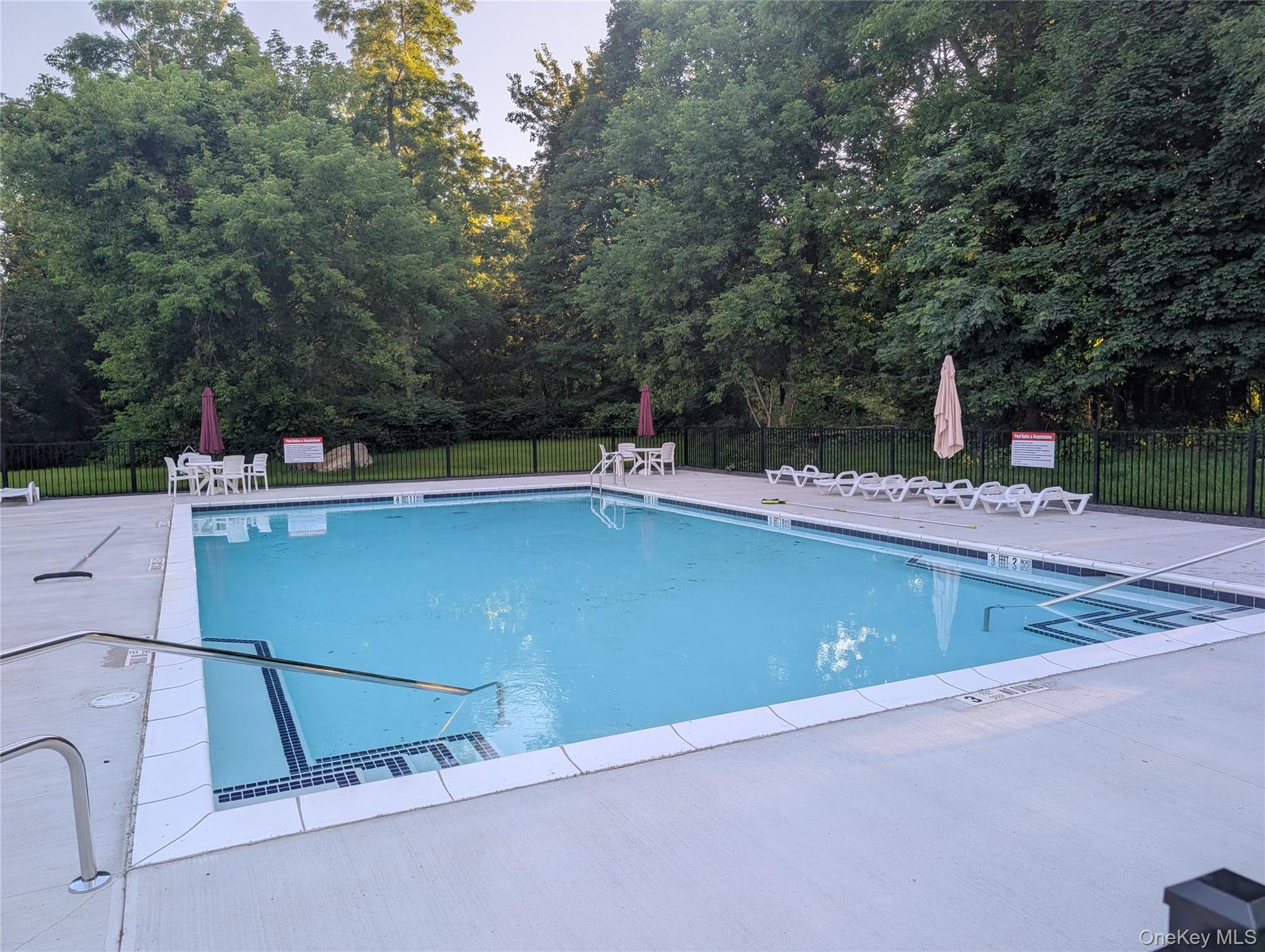 69 Magnolia Park Road Middletown, NY 10940 - Photo 42 of 43 Community pool featuring a patio area and view of scattered trees