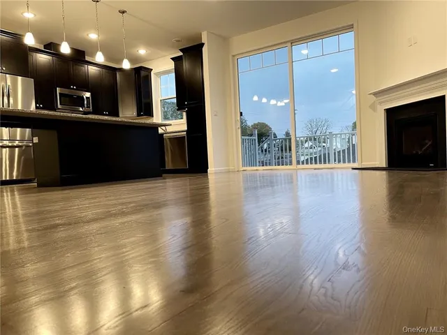 a view of kitchen with kitchen island and living room