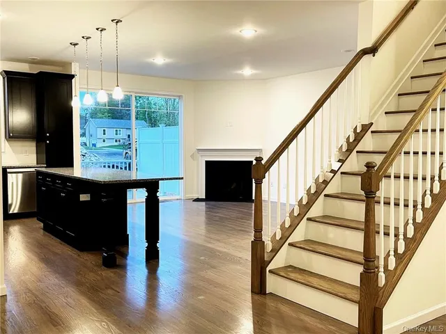 a view of entryway with dining room and wooden floor