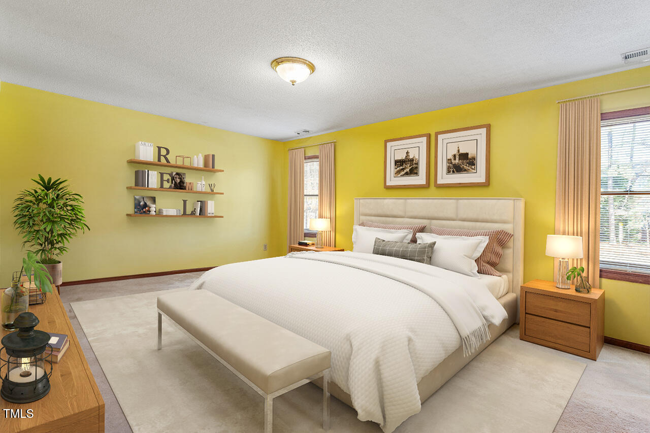 8420 Two Courts Drive Raleigh, NC 27613 - Photo 15 of 46 a bedroom with a bed and a couch