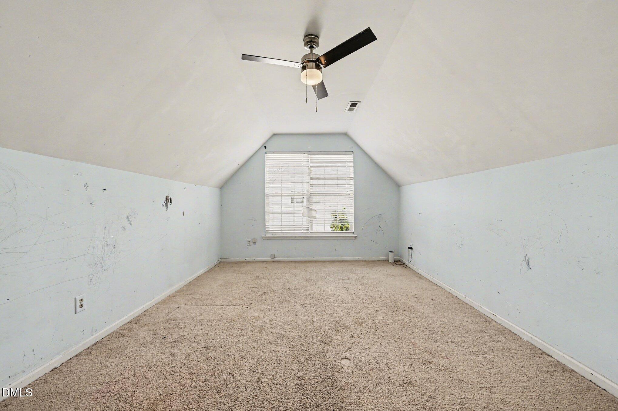 5115 Cardinal Grove Boulevard Raleigh, NC 27616 - Photo 18 of 36 an empty room with windows and a ceiling fan