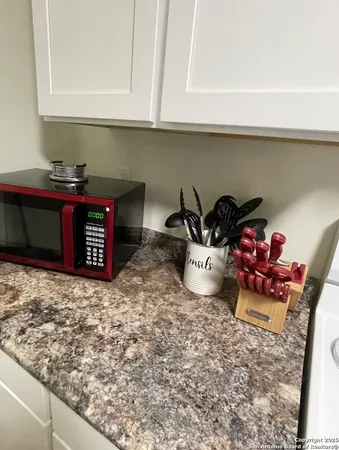a table chair sitting in a kitchen