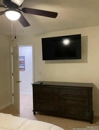 a bed room with a bed and a wall painting