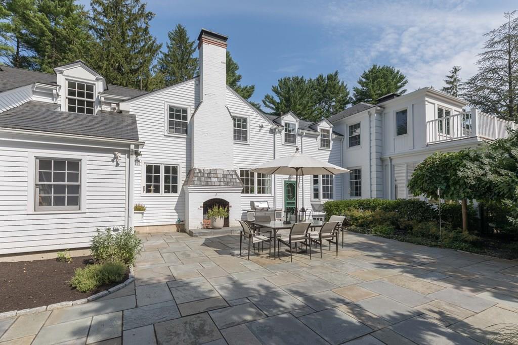 389 Grove Street Needham, MA 02492 - Photo 12 of 20 a view of a white house with table and chairs
