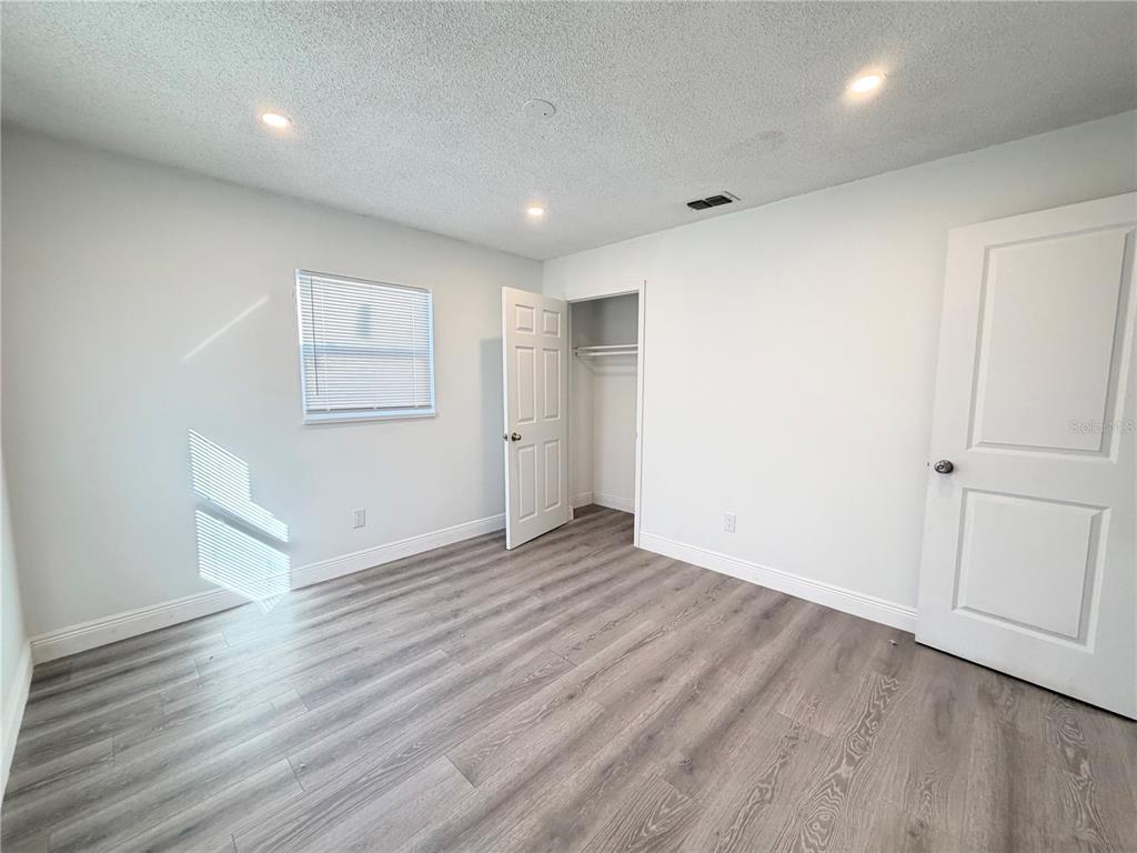 3207 Chariot Place Orlando, FL 32818 - Photo 15 of 21 a view of empty room with wooden floor